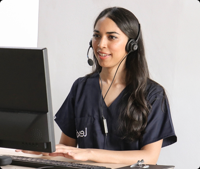 Lexie Expert wearing a headset and on a video call on the computer.