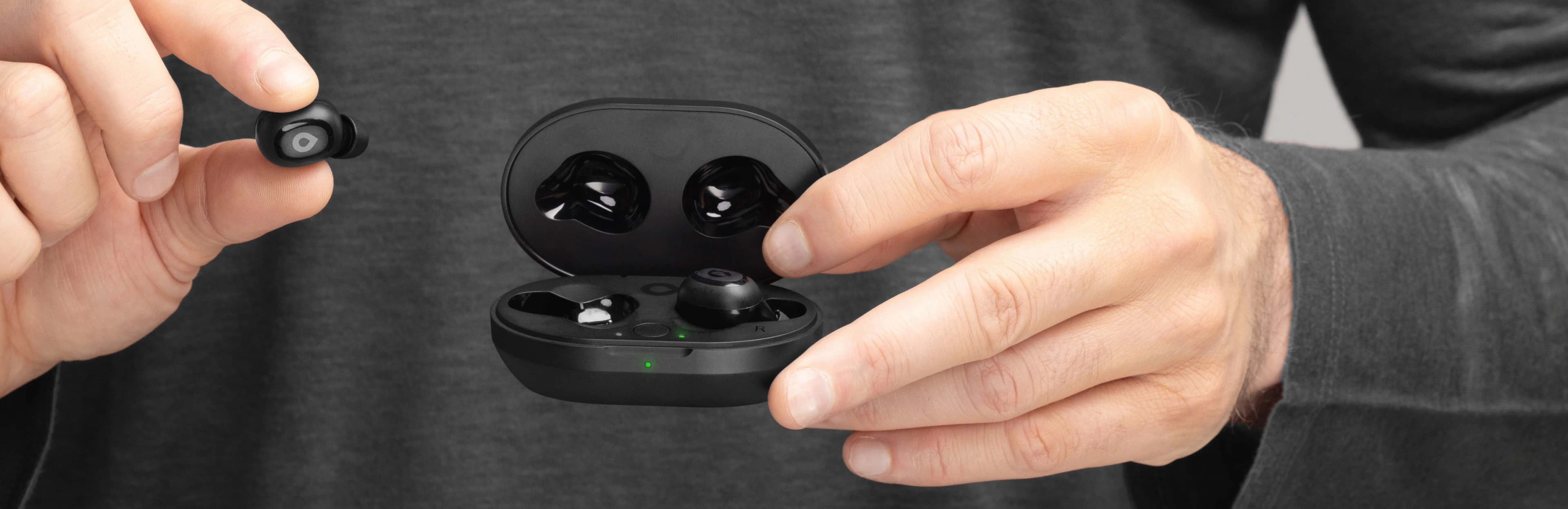 Hand holding Lexie H1 Hearing Buds