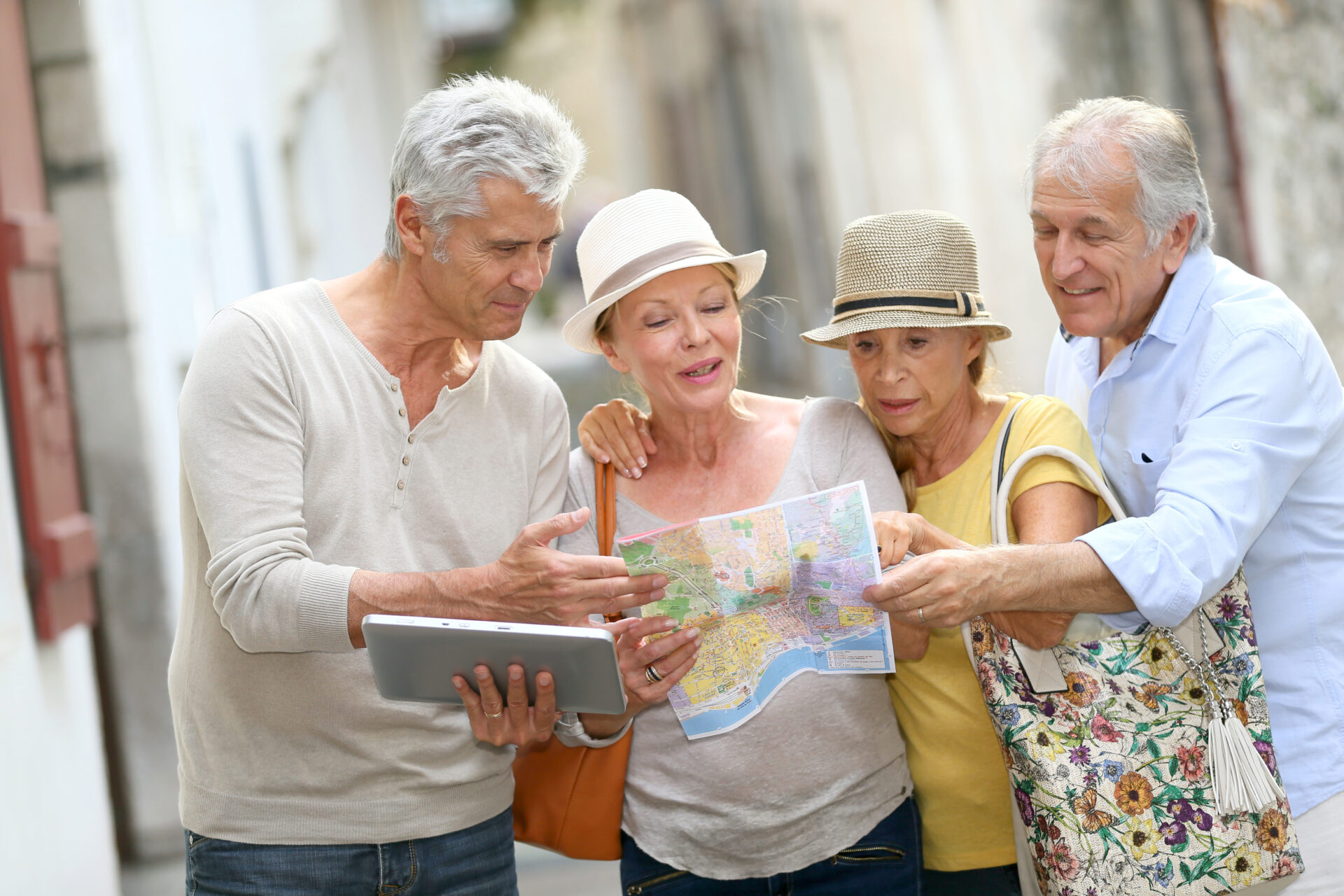 A group of senior tourists looking at a map