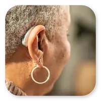 Lexie Lumen Lifestyle | Behind view of a woman wearing Lexie Lumen hearing aids thumbnail.