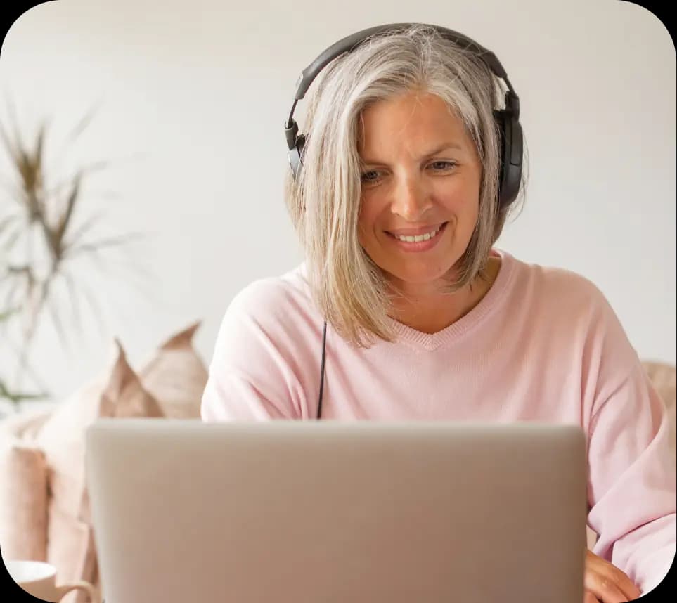 Lady with headset working on laptop